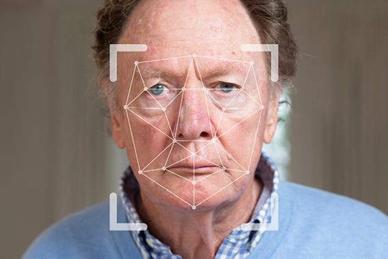 Man having his face scanned by a computer