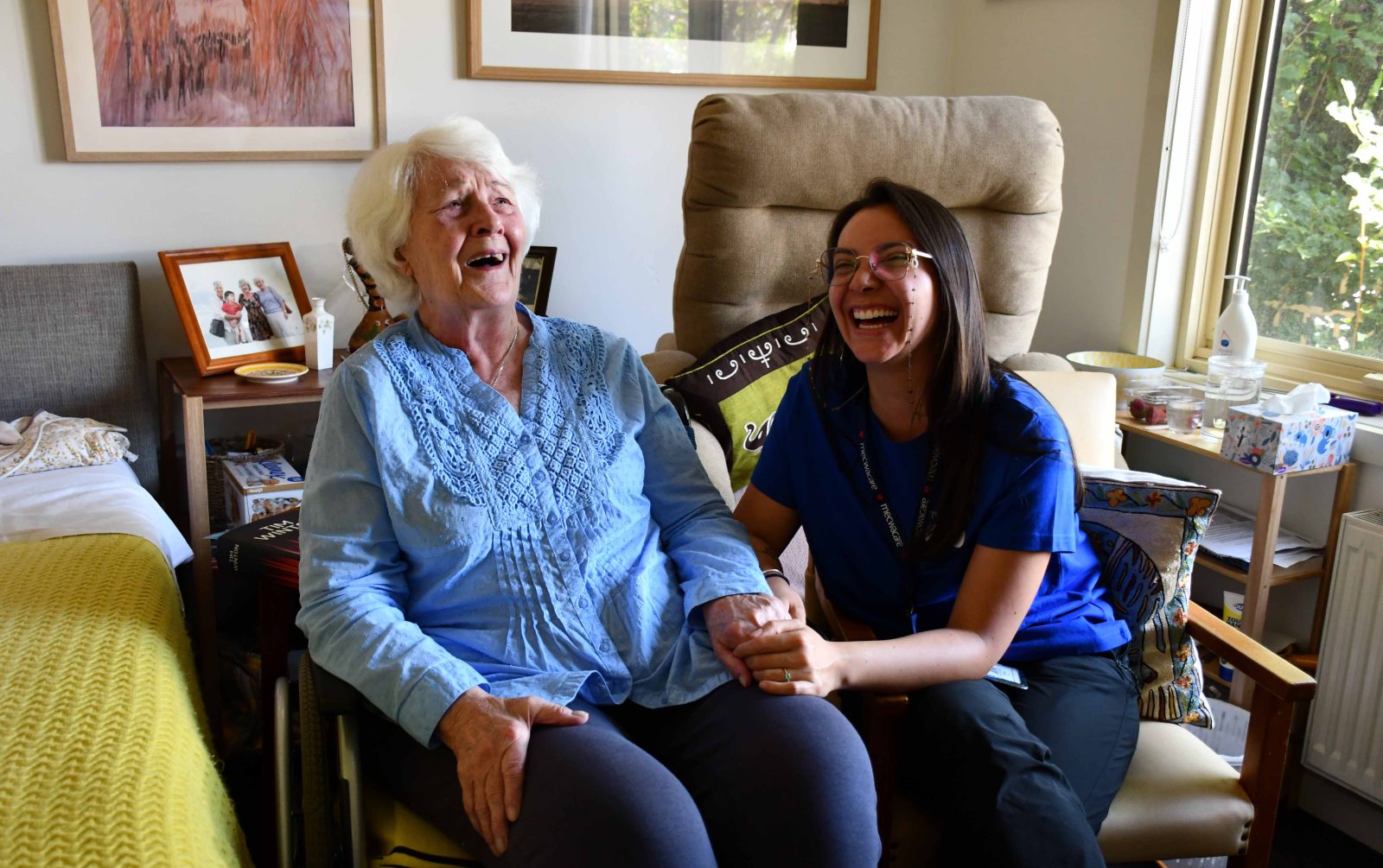 Resident and staff laughing