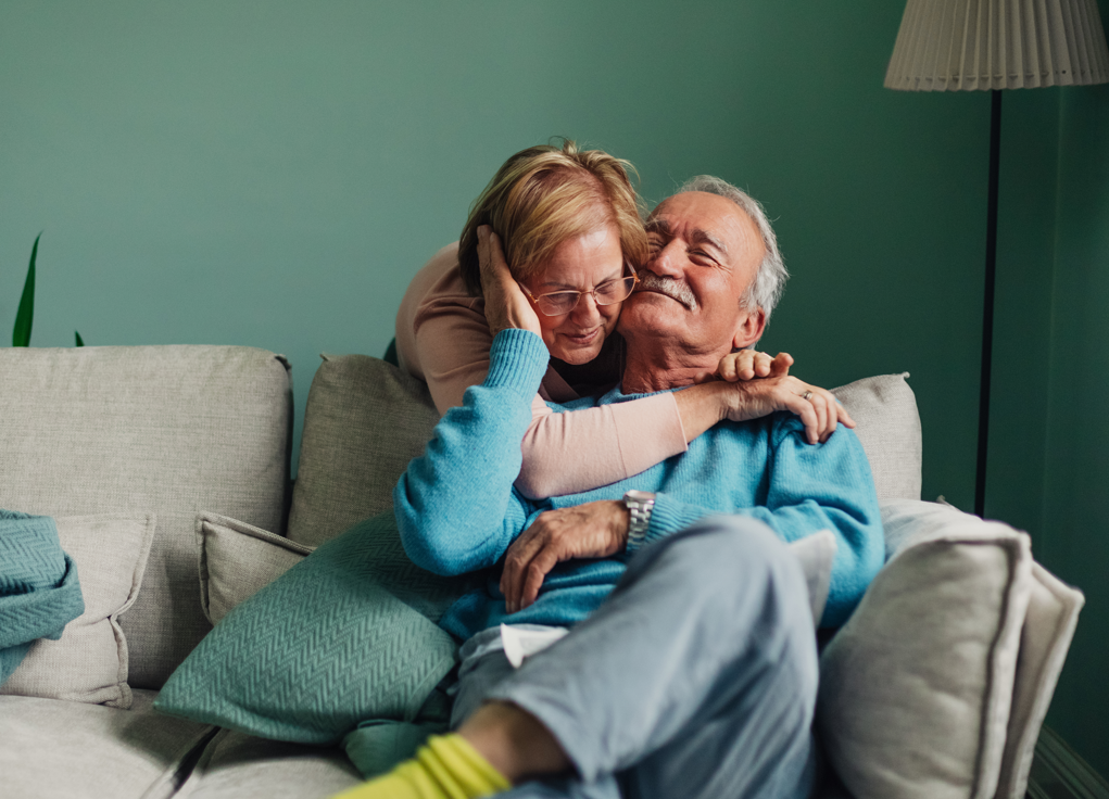 Couple hugging at home